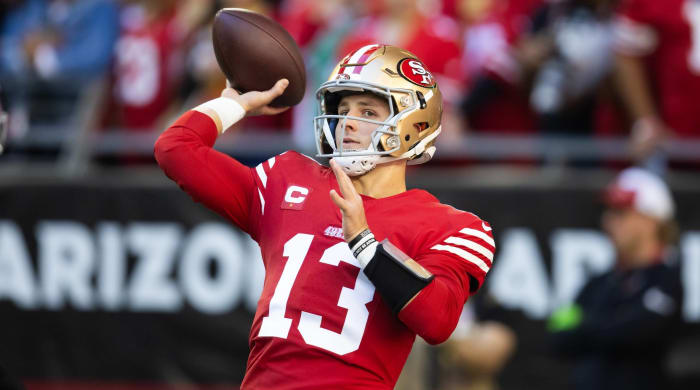 San Francisco 49ers quarterback Brock Purdy throws a ball in warmups before a game.